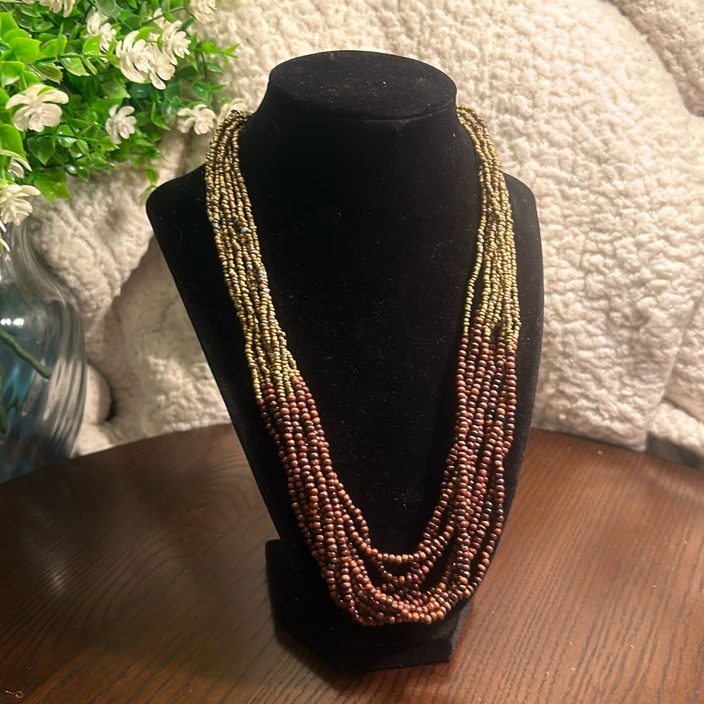 Multi-strand seed bead necklace with extender